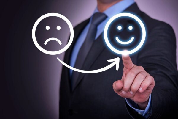 Two Smiley Faces in White on a Glass Screen